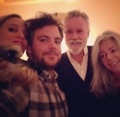 A picture of Felix with his parents and sister.